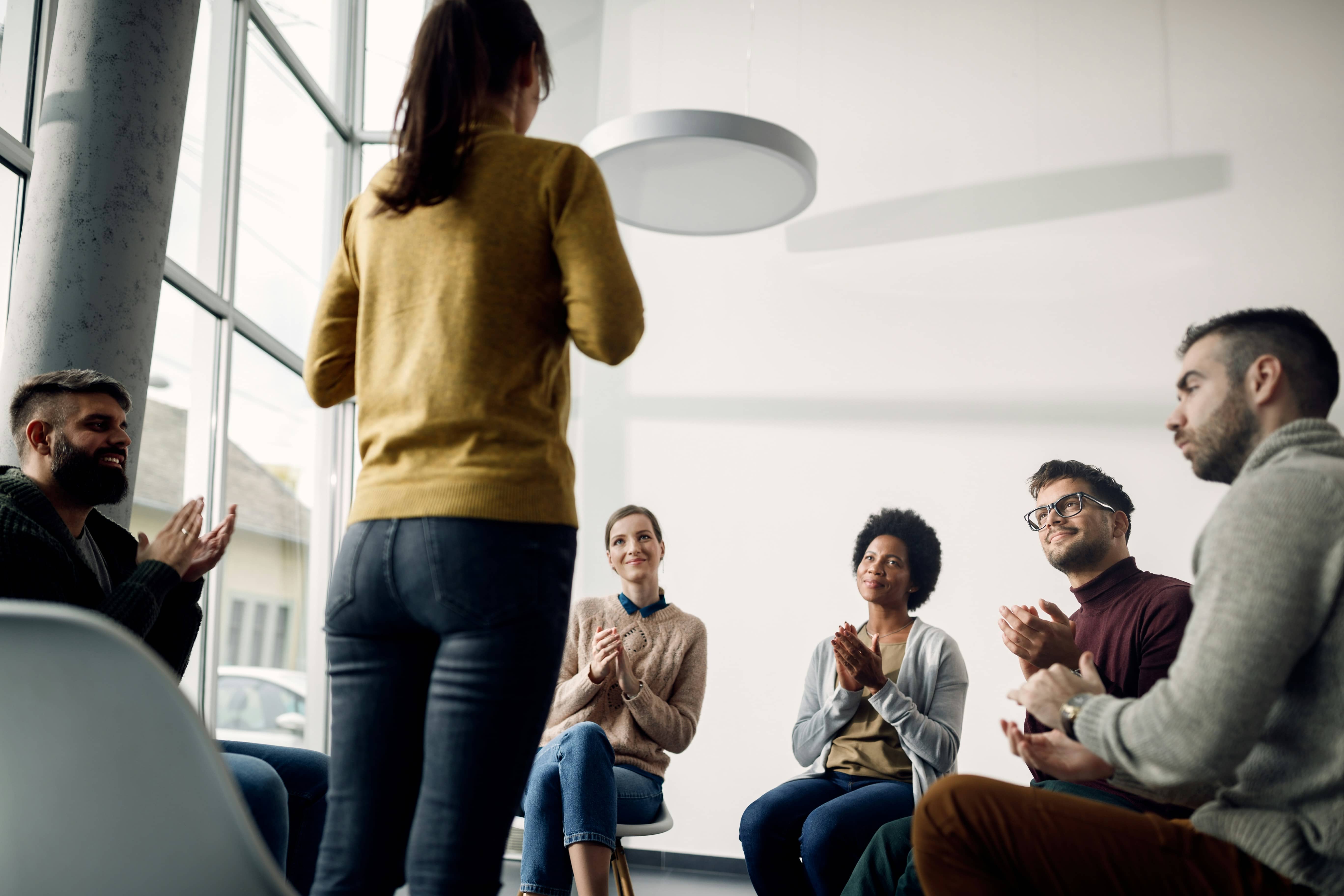 A group of people in a group therapy session.